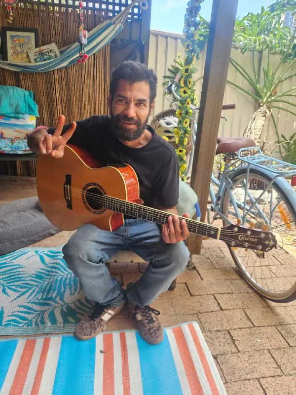 Craig playing the guitar