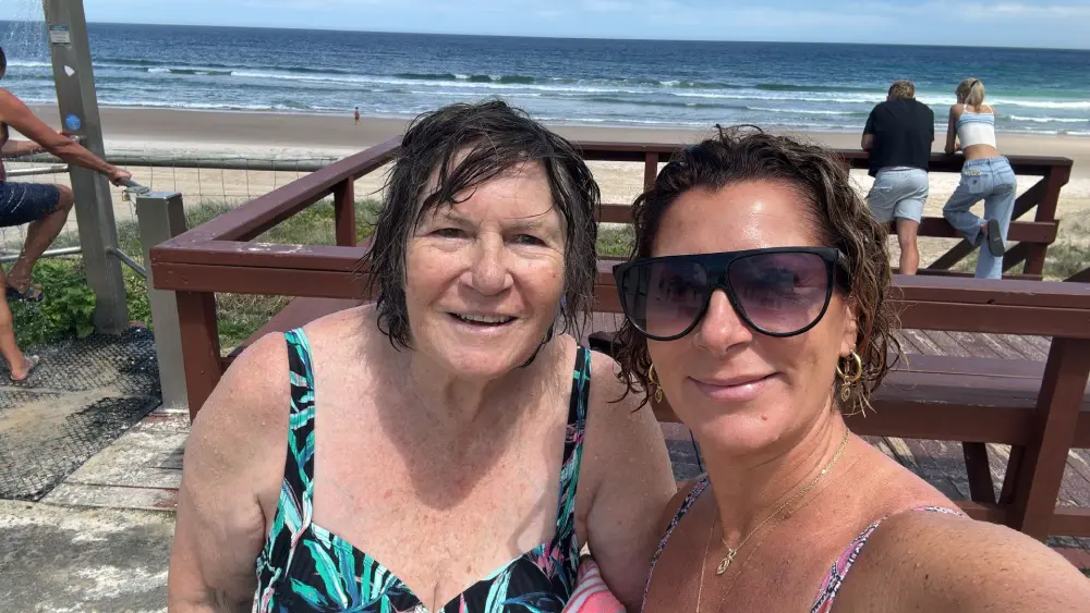 Sue at the beach with Chrissie